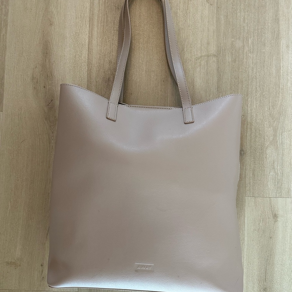 Away Travel Longitude Laptop Tote. Leather blush nude buff. Luggage sleeve strap